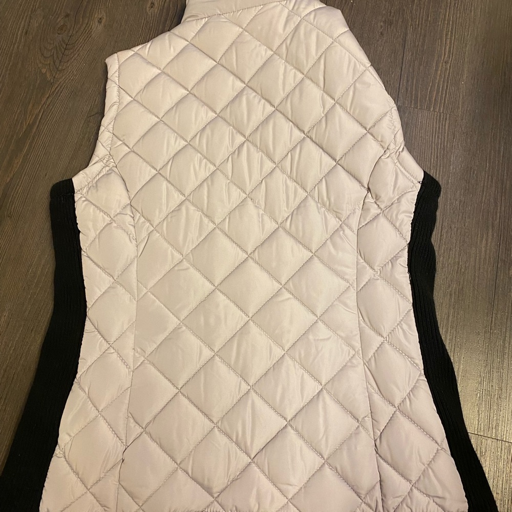Size small women’s light grey vest with black. Brand new with tags.
